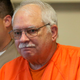In this May 31, 2016, file photo, Robert Bates, a former Oklahoma volunteer sheriff’s deputy who said he mistook his handgun for his stun gun when he fatally shot an unarmed suspect in 2015, is escorted from the courtroom following his sentencing at the courthouse in Tulsa, Okla.